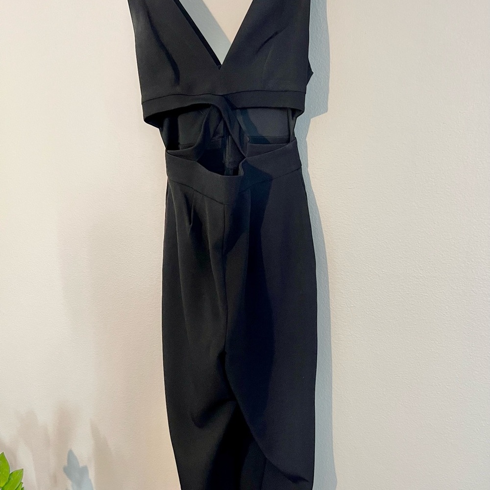 Express black jumpsuit with deep V and cutouts, never worn.